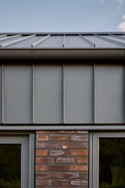 Past and future meet in steel-clad terraced houses with history in the backyard, Jernaldervej 8, 8600 Silkeborg, Denmark